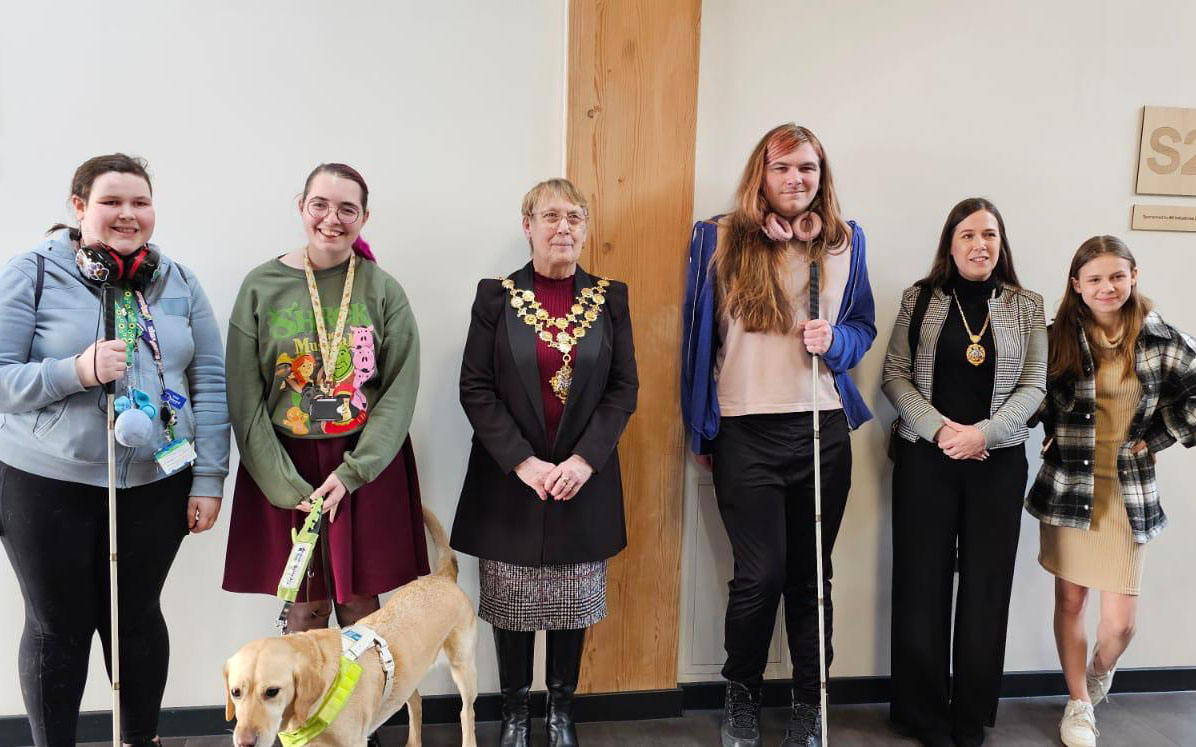 The students stand with the Mayor of Hereford and other dignitaries as she closes the event