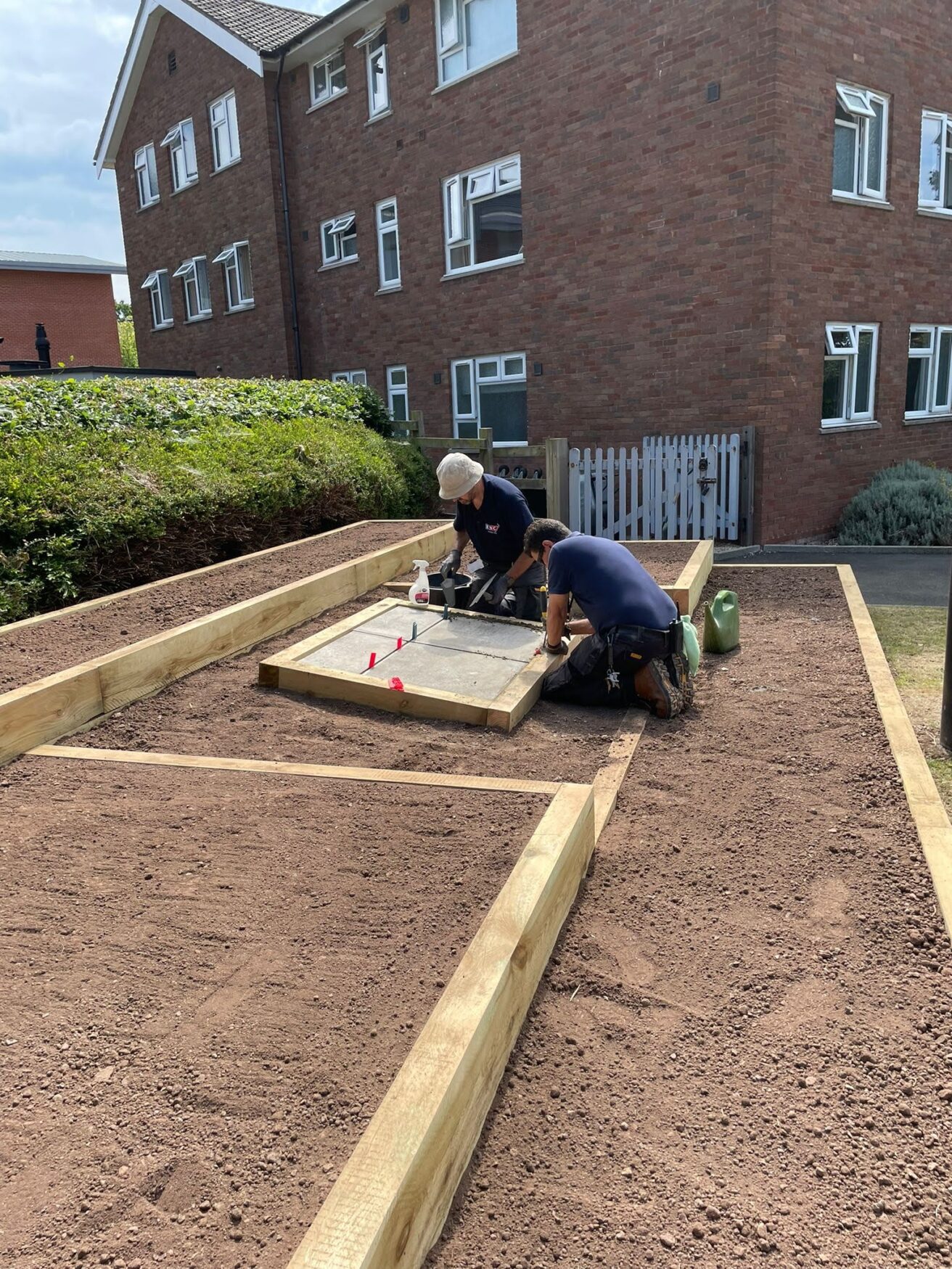 Dave and Phil secure the slabs ready to take the mosaic