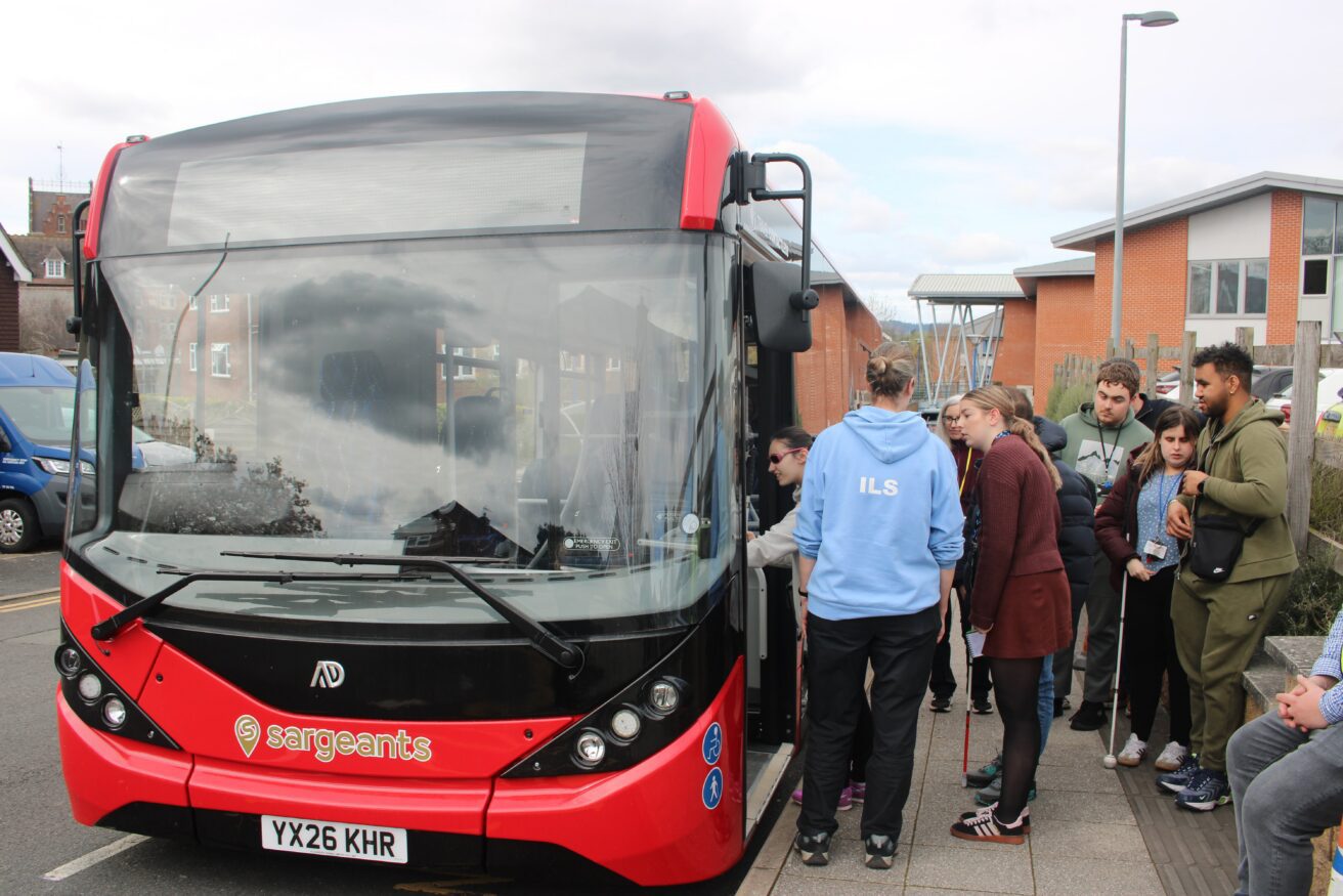 Staff and students queuing up ready to explore the bus
