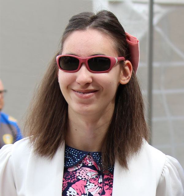 A headshot of Christina smiling