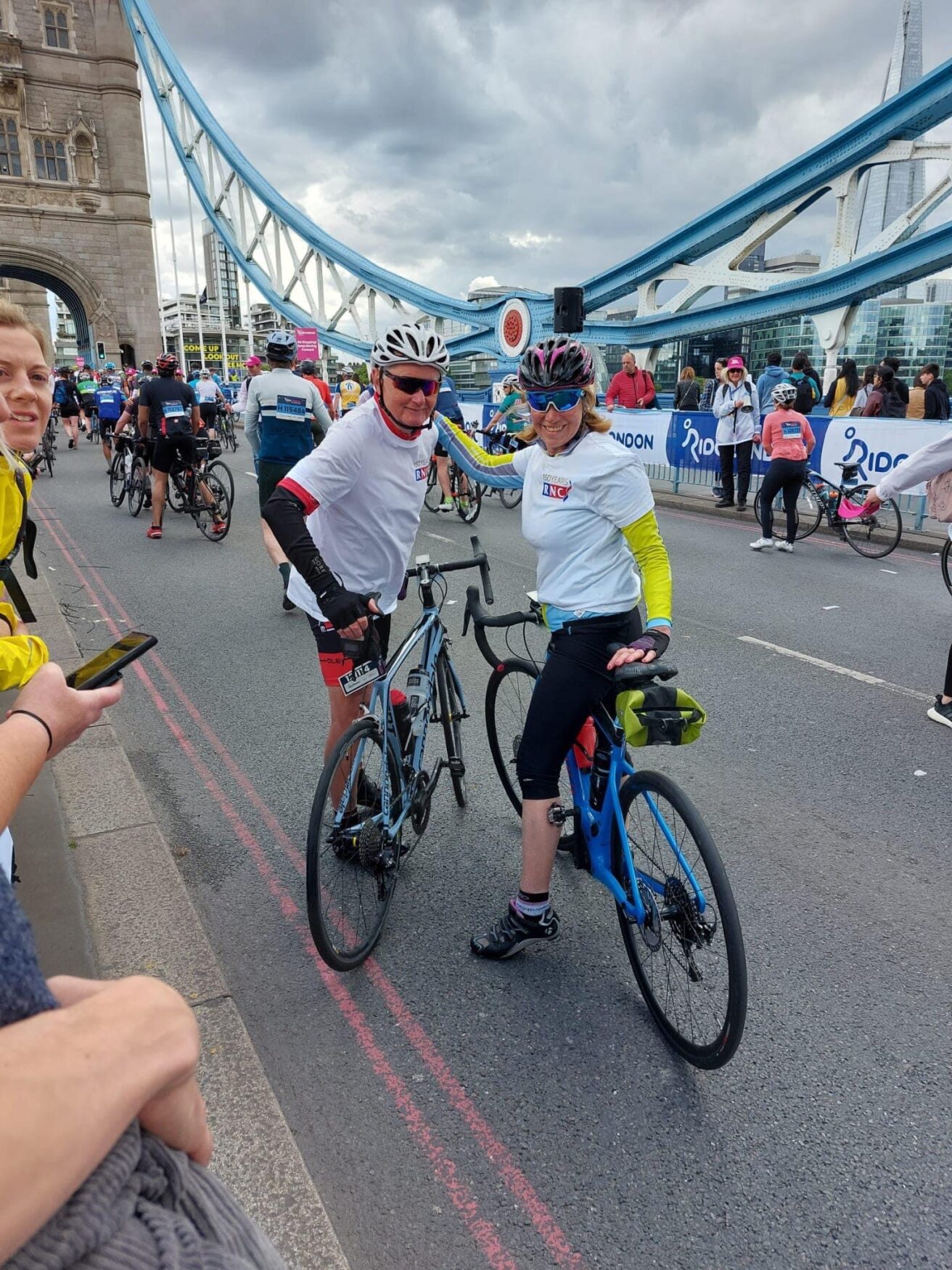 Bill and Sheila pictured on tower bridge on their bikes