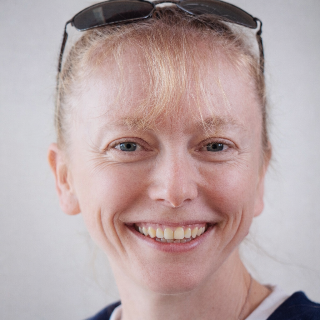 A headshot of a smiling Flea
