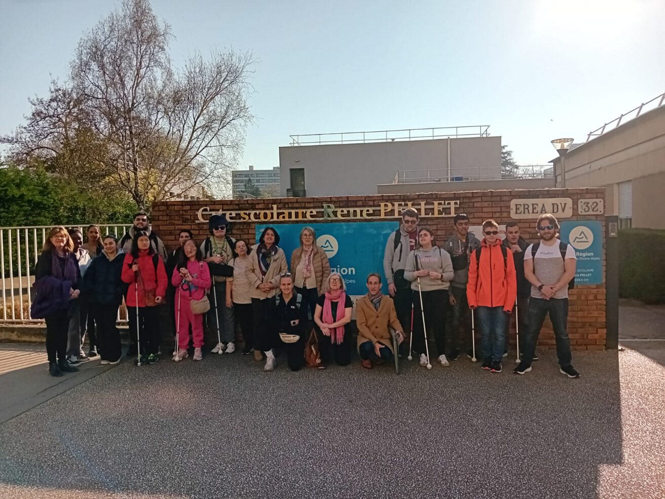 Staff and students in front of the entrance to the Cité scolaire René Pellet
