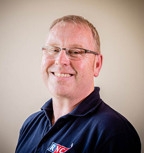 Photo of Andy Powell smiling and wearing an RNC polo shirt