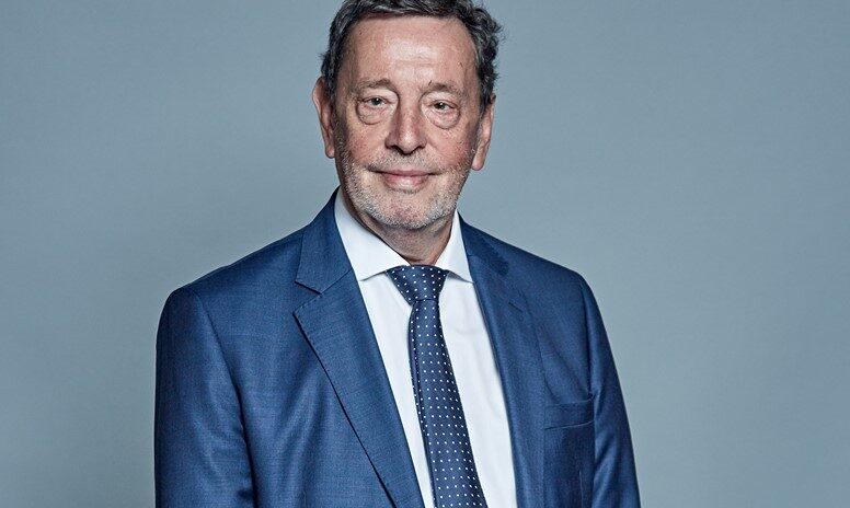 Photo of The Rt Hon the Lord David Blunkett wearing a blue suit and tie.