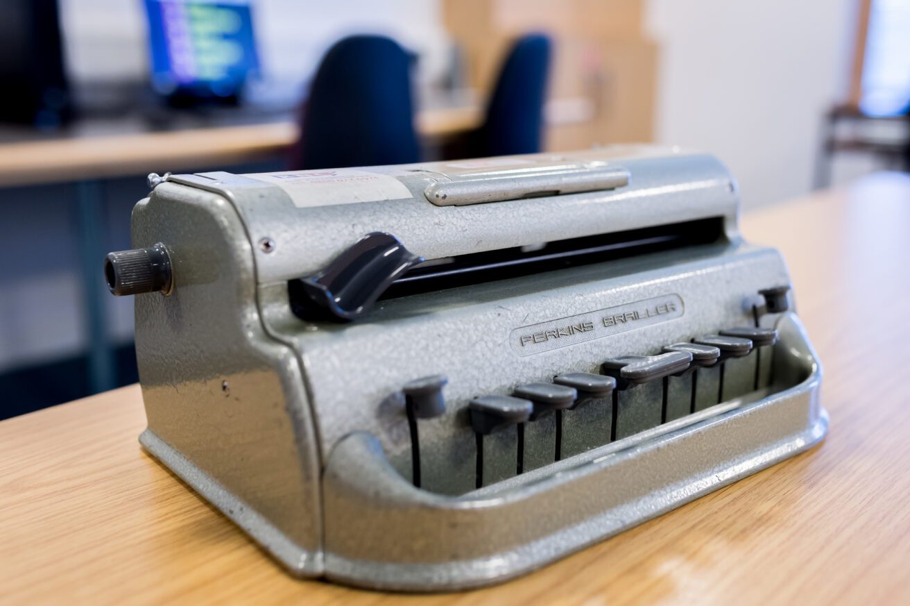 a Perkins Braille machine on a table