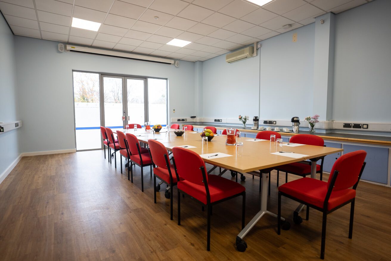 One of the studios laid out in a board room style